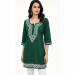 Model wearing 30-inch short Chikankari rayon kurti top styled with jeans for an Indo-Western look
