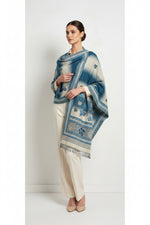 A woollen weaved scarf with a double-sided design, featuring a maple traditional pattern on borders and in the middle, primarily in teal and beige colours. 2. 5 Yard long and 1 yard wide shawl by Fama za Couture