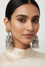 Dual-tone oxidised silver stone studded jhumka earrings by Famaza Couture