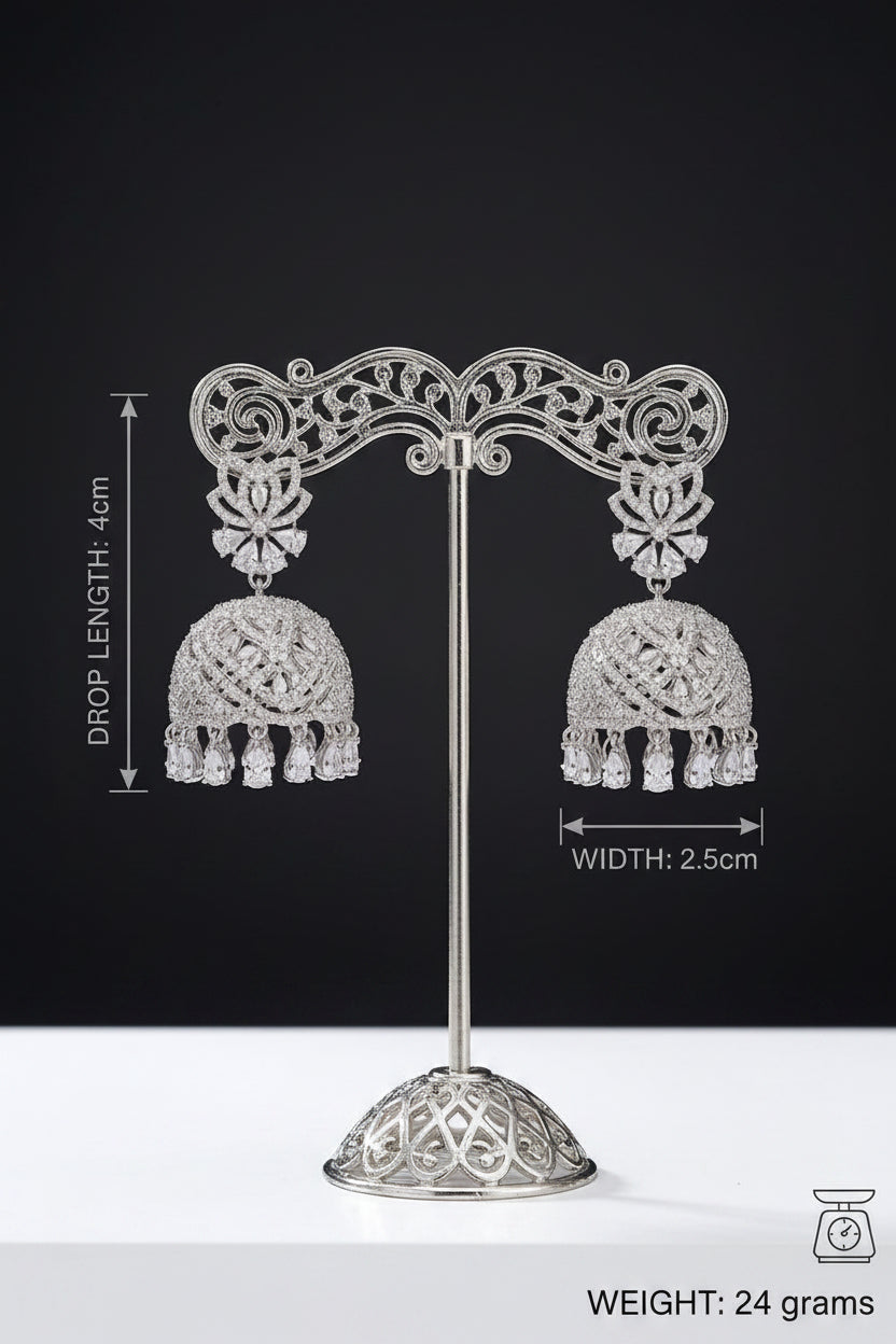 Silver-toned double earring set on a metal display stand against a black background, with measurement annotations showing drop length 4 cm, width 2.5 cm, and weight 24 grams.