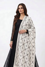 Model wearing a monochrome floral lattice Bakhiya embroidered cotton dupatta over a black dress.