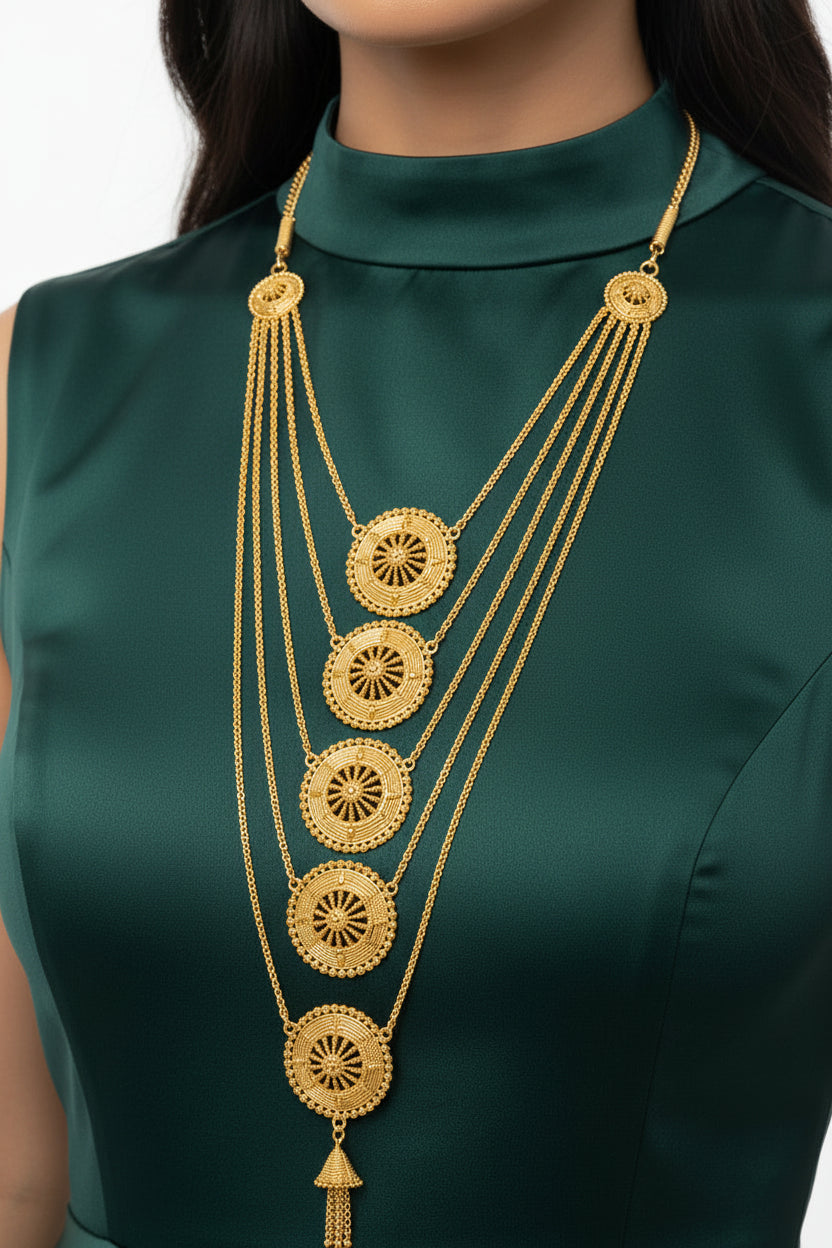 A detailed close-up shot of the Ayesha Luxe gold-plated multi-layered necklace, highlighting the intricate circular medallion motifs and fine chain craftsmanship by Famaza Couture.
