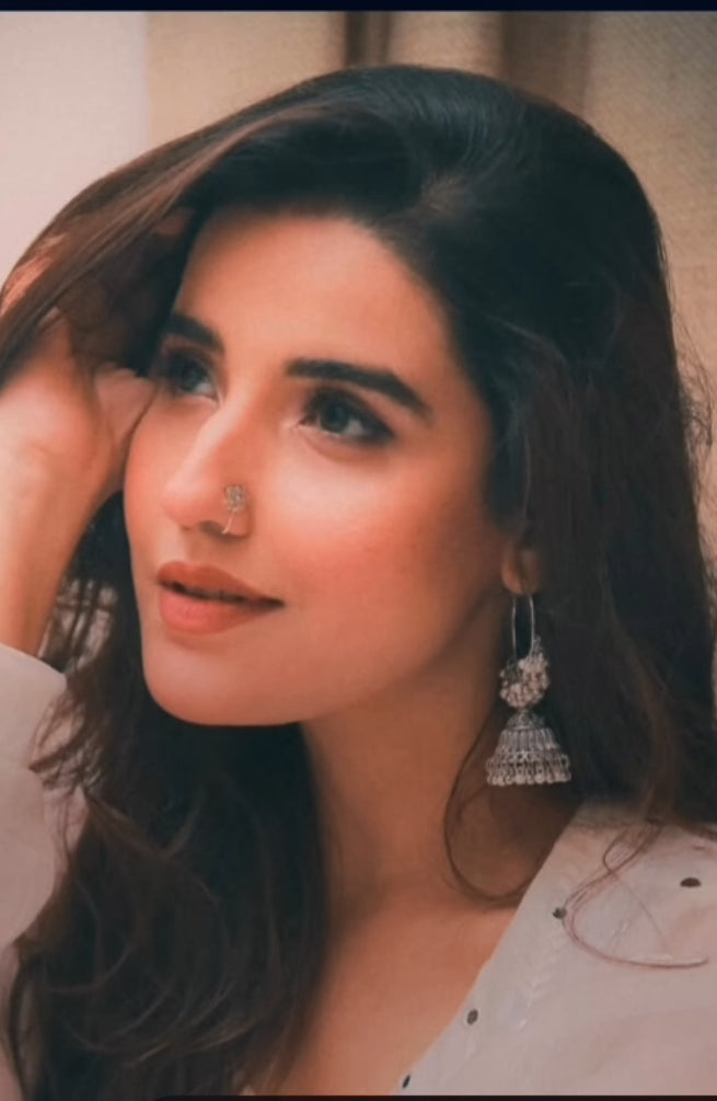 Close-up of press-on nose pin