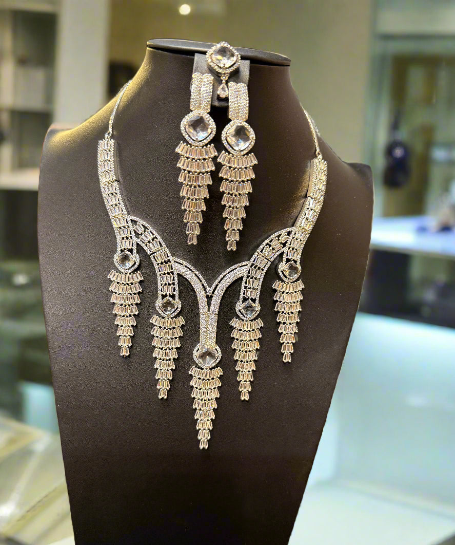 Close up silver chandelier earrings with baguette CZ stones from cascade set