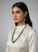 Beaded mala with silver and pearl beads in on both sides start and drop is designed with multi colour glass nano bead and silver ball beads, along withLotus design earrings with silver and pearl beads in drop. Oxidised party wear jewellery set.