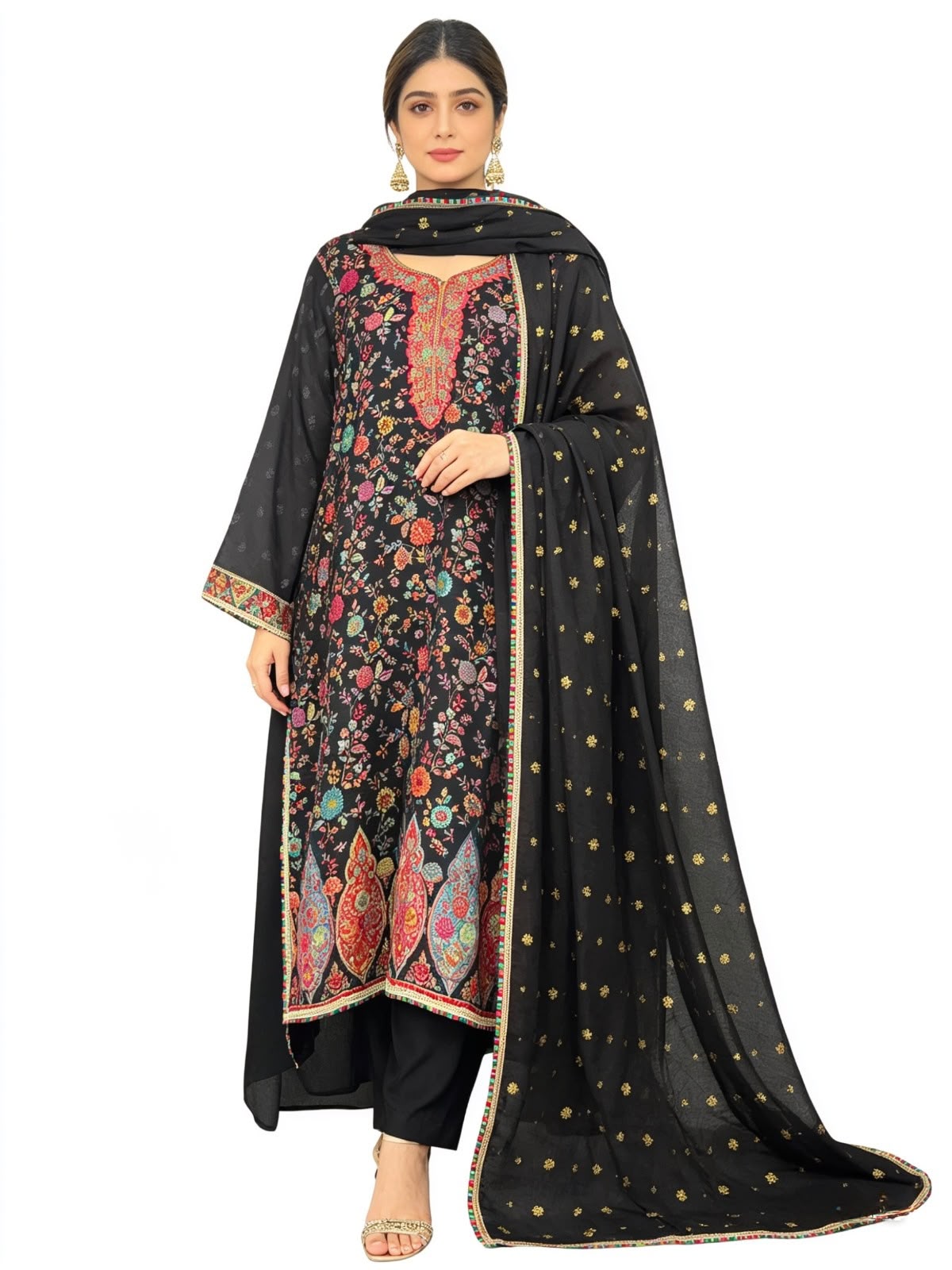 Model wearing a premium black silk kurta set with Kanni embroidery, zari work, and raw silk trousers, presented on a pure white background