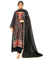 Model wearing a premium black silk kurta set with Kanni embroidery, zari work, and raw silk trousers, presented on a pure white background