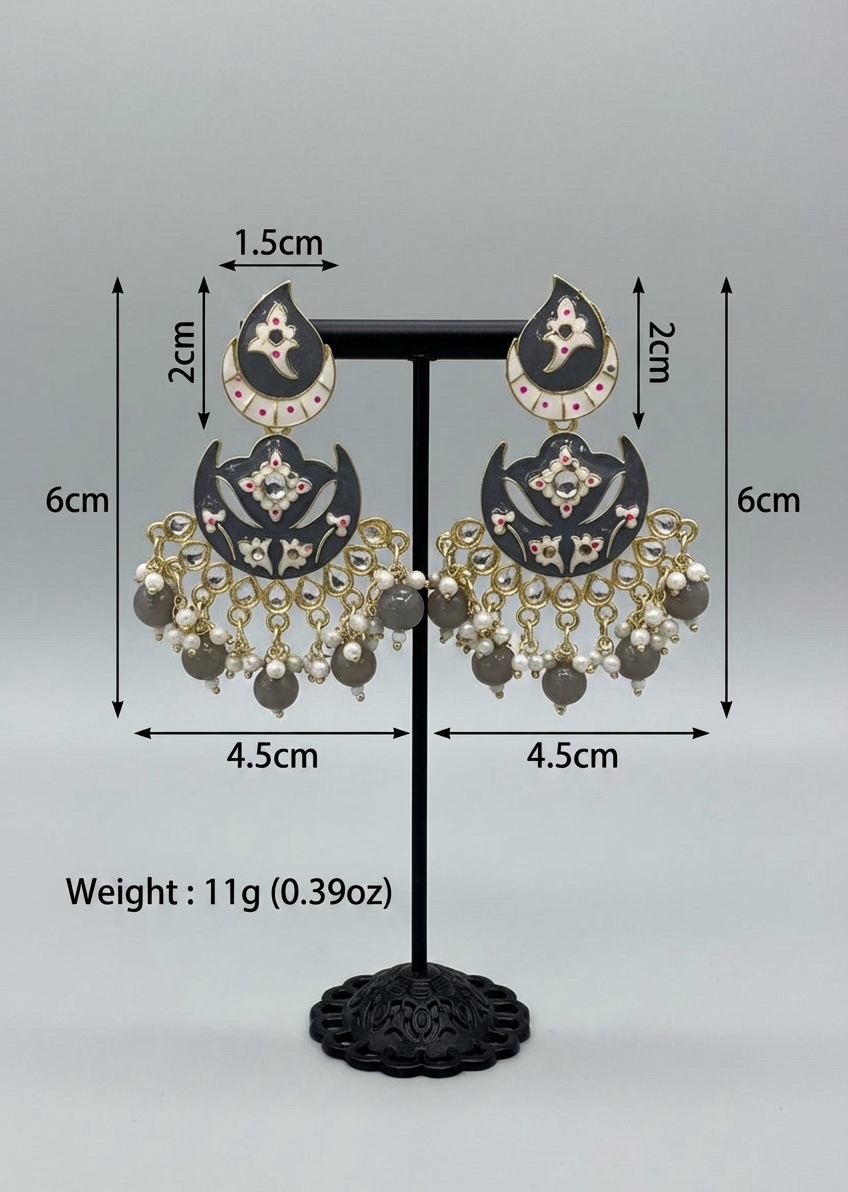 Black and gold earrings with pearl-like beads on a stand, showing measurements and weight.