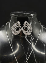 Black centre stone earrings, featuring a geometric design with intricate detailing, displayed on a mannequin. Party wear set.