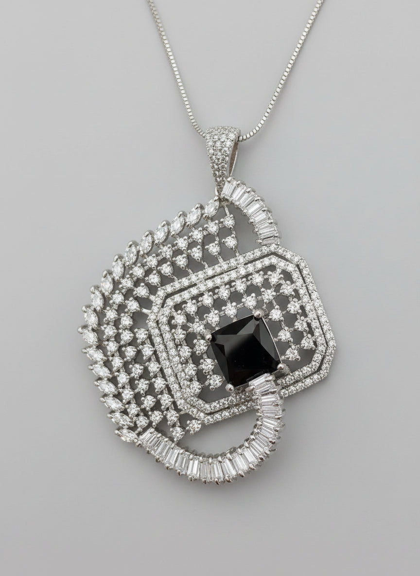 Black centre stone pendant, featuring a geometric design with intricate detailing, displayed on a black mannequin. Party wear set.