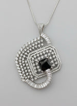 Black centre stone pendant, featuring a geometric design with intricate detailing, displayed on a black mannequin. Party wear set.