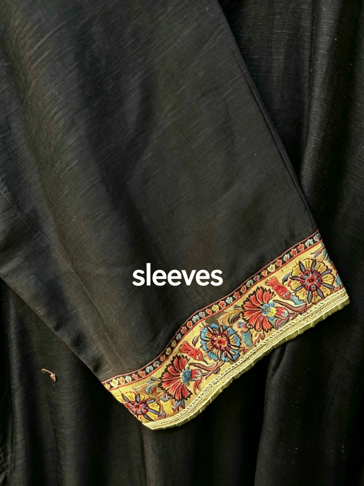 Black kanni silk kurta sleeve design.