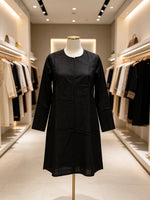Black kurti is on a mannequin in a Famaza Couture