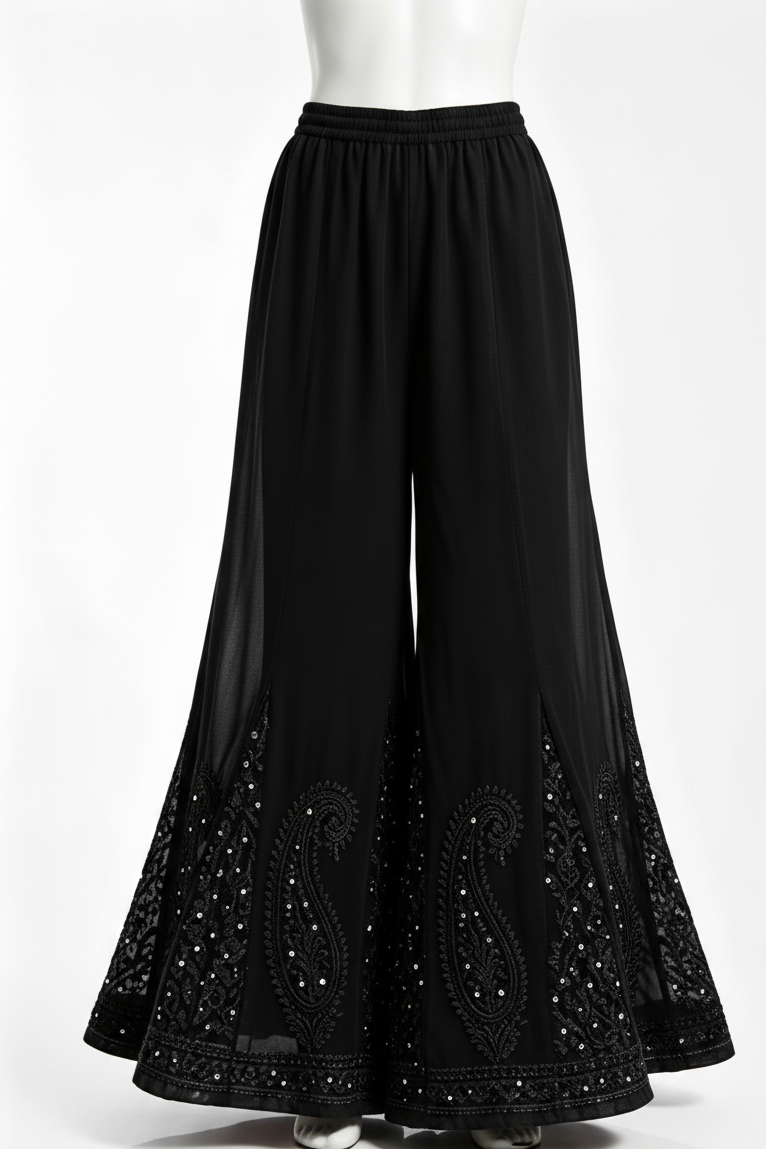 Black sharara with black bakhiya and silver kaamdani work.