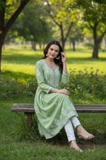 Chikankari apple green long dress with pockets, with hand embroidery by famaza couture