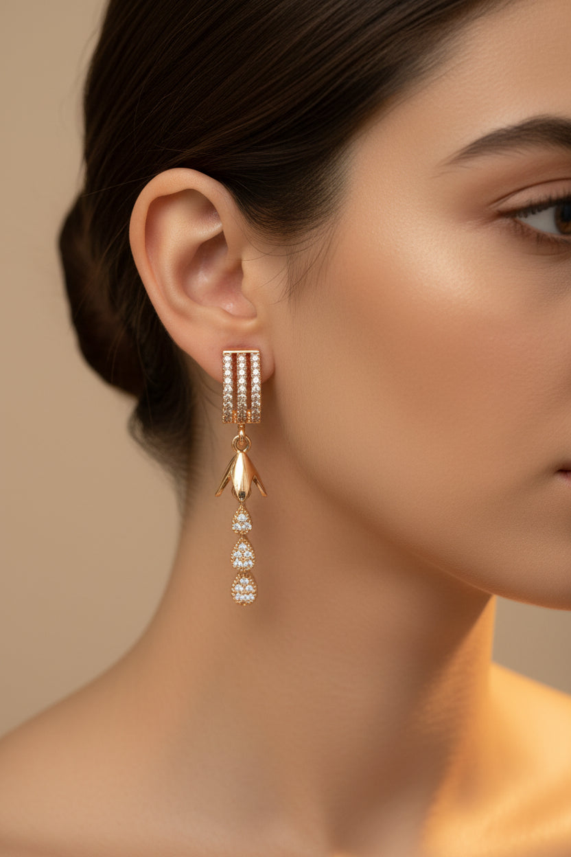 Close-up of 4cm rose gold finish earrings featuring a triple-row arched stud and a cascading tiered teardrop drop.