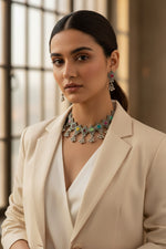 Close-up of a model wearing the tribal-style oxidised silver choker set with a boho-chic outfit.