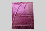 Close-up of a purple velvet stole with Swarovski embellishments and floral patterns.