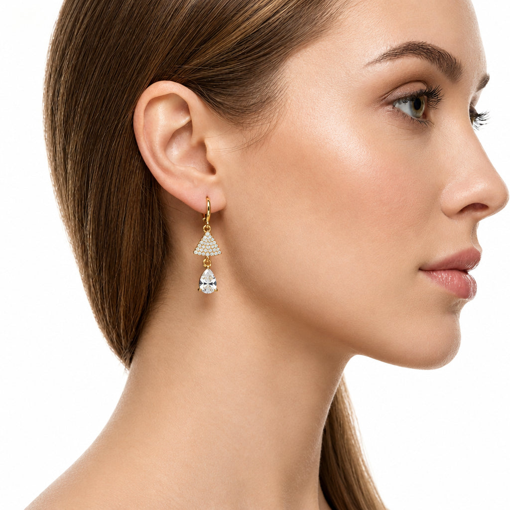 Close-up of a woman wearing a American diamond earring on a white background
