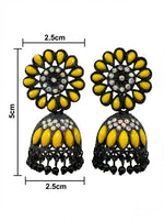 Close-up of black brass jhumka earrings featuring a vibrant yellow floral stone stud and matching yellow stone accents on the jhumka.