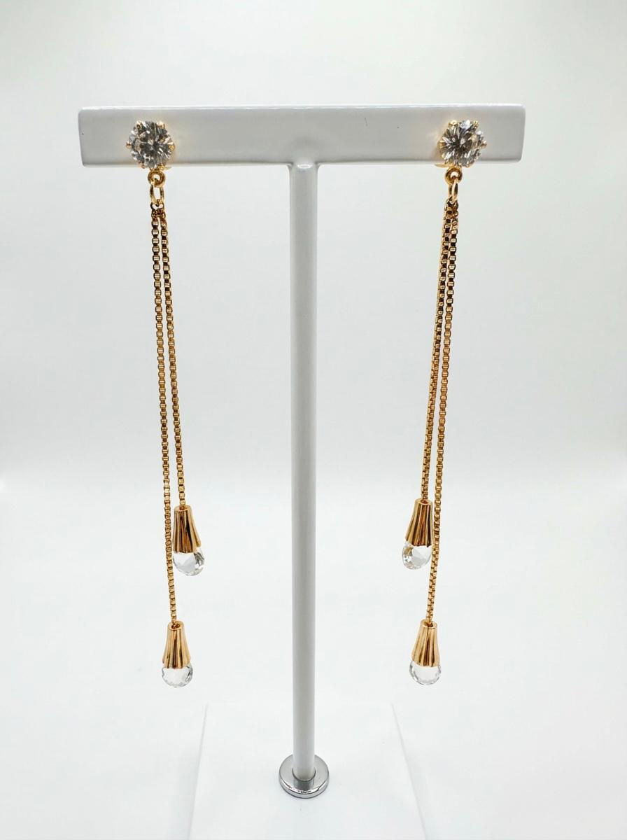 Close-up of the sparkling white American Diamond stones and premium rose gold finish on the Celestial 10cm extra-long earrings.