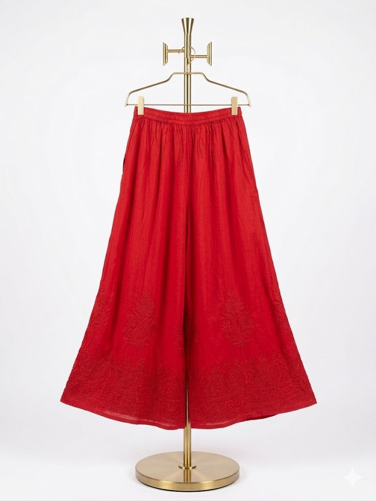 Crimson red cotton wide leg plazzo pants are displayed on a stand.