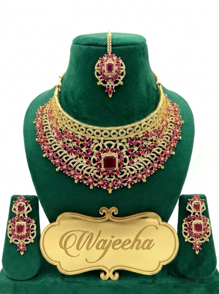 Detailed flat lay view of imperial bridal necklace , matching chandelier earrings and tikka.