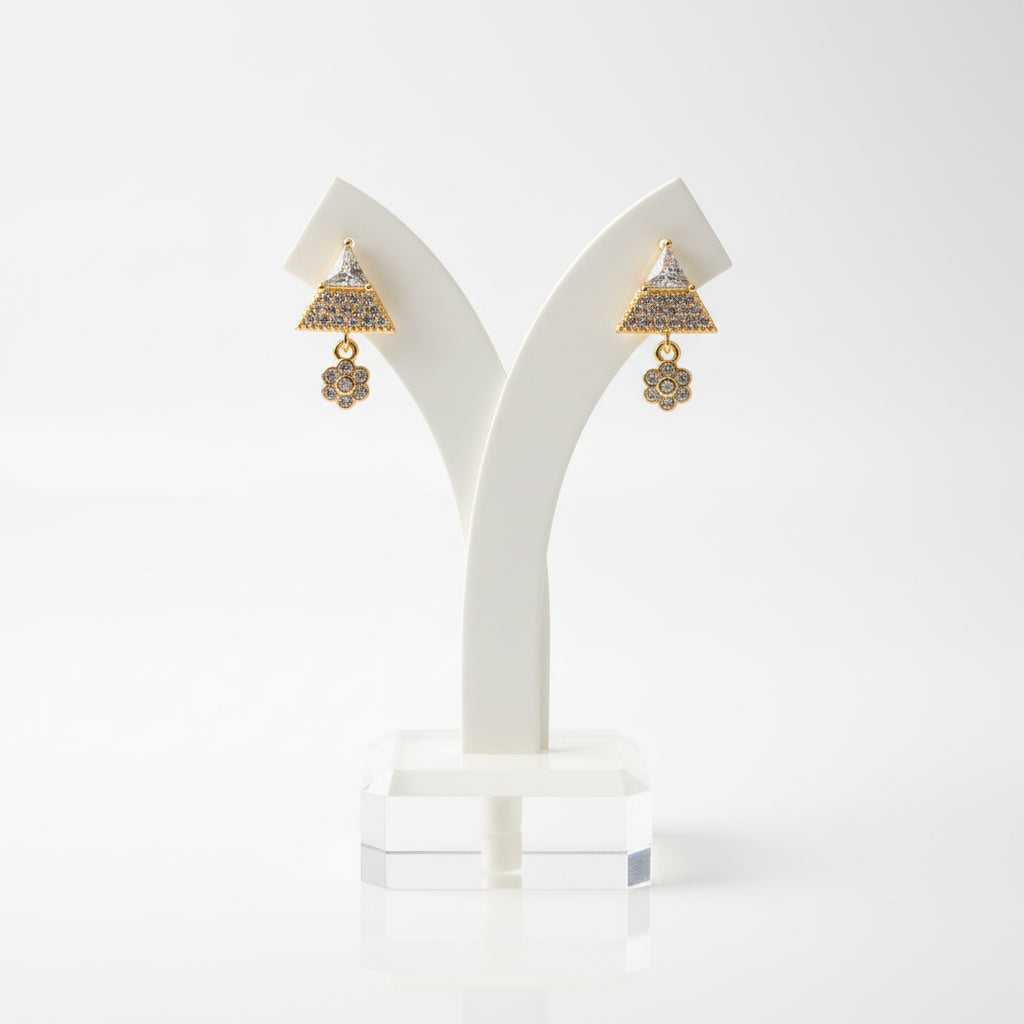 Detailed shot of the 2cm Starlight rose gold polish earrings on a display stand, highlighting the crystal clarity.