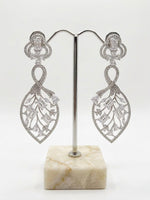 Detailed studio view of the Silver American Diamond leaf-motif dangles, highlighting the 2cm width and shimmering stone-encrusted frame.