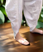 Close-up of white dhoti pants