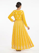 A Model is showing the rear view of this Yellow chikankari hand embroidered Aanarkali long dress.