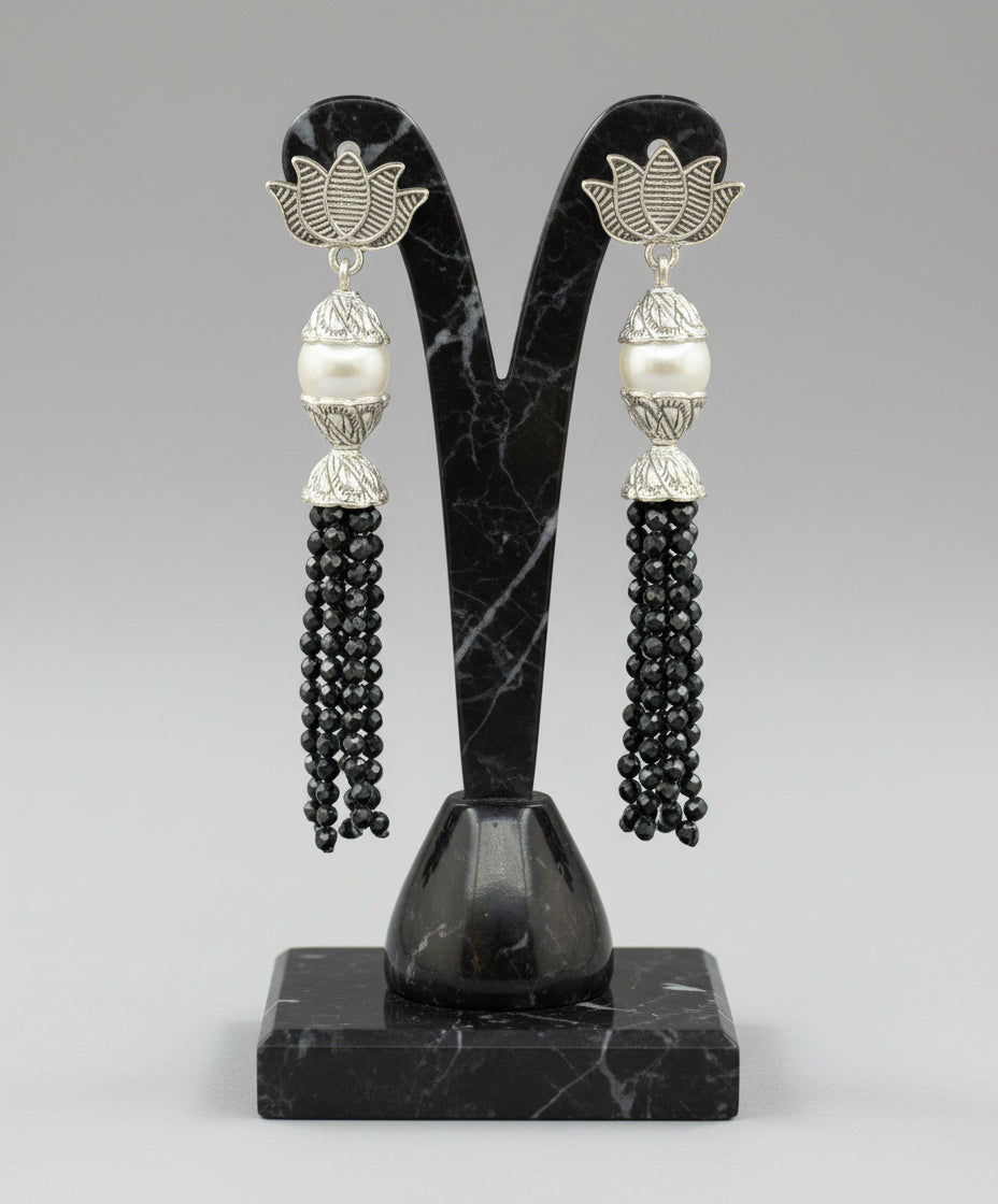 Earrings with Lotus flower stud than white pearl and than black colour glass beads multi layers in hanging design.
