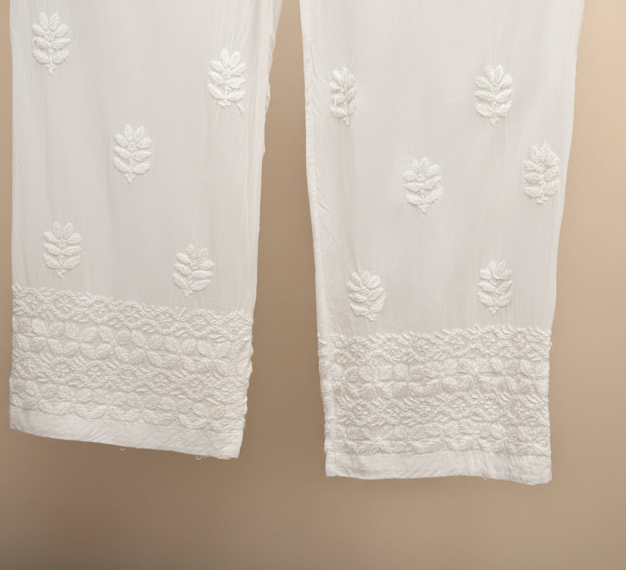 Eco-luxe white modal palazzo pants with delicate hem embroidery