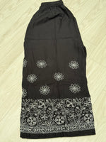 Elastic waistband of black cotton flared pants – stretches 28 to 48 inches