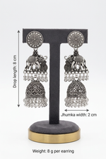 Royal Parade silver-toned elephant jhumka earrings on a stand with annotations showing 8 cm drop length, 2 cm width, and 8 g weight