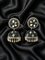 Black mirror bead jhumka — jet black micro-beadwork, multi-tone mirror inlays, polished gold-silver trim & curved ghungroo drops, laid on draped black silk — Famaza Couture.