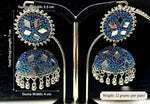 Cobalt blue iridescent mirror bead jhumka — 7cm total drop, 3.5cm top stud, 4cm dome, 22g pair — displayed on gold stand with black velvet backing — Famaza Couture.