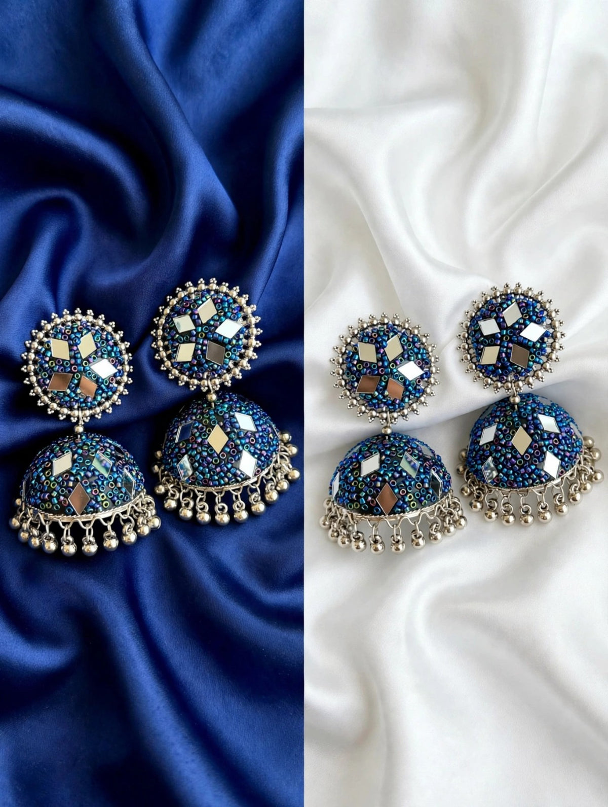 Pair of cobalt blue multi-mirror bead jhumka earrings — left on royal blue satin, right on white silk; oxidized silver finish, mixed gold/silver mirror inlays, hanging ghungroos — Famaza Couture ethnic bridal jewelry.