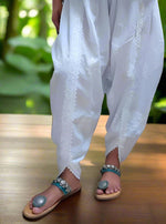 Detail of the fabric and design of white dhoti pants