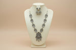 Full view of the artisan mirror-work long necklace and jhumka set displayed on a jewelry bust.