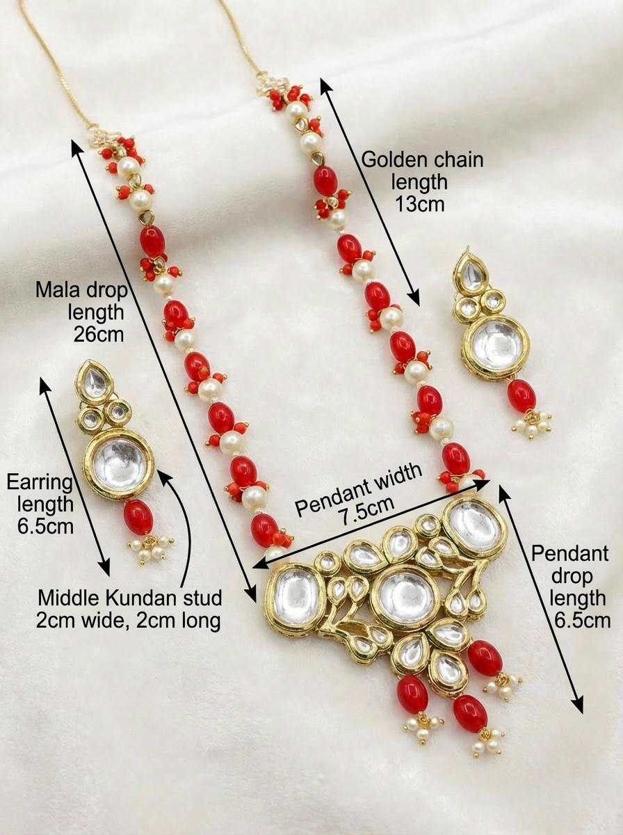 Full view of the regal Kundan bridal necklace and matching earrings set displayed on a white satin background.