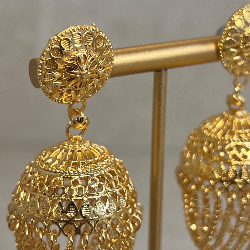 Close up of antique gold filigree lattice work and pearl clusters on Zayna Kashmiri jhumka