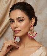 Gold-plated Chaand Bali earrings featuring pink paisley studs, intricate Kundan work, and vibrant pink bead drops.