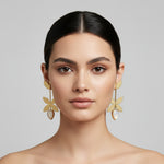 Gold leaf earrings with a white stone centre by famaza couture