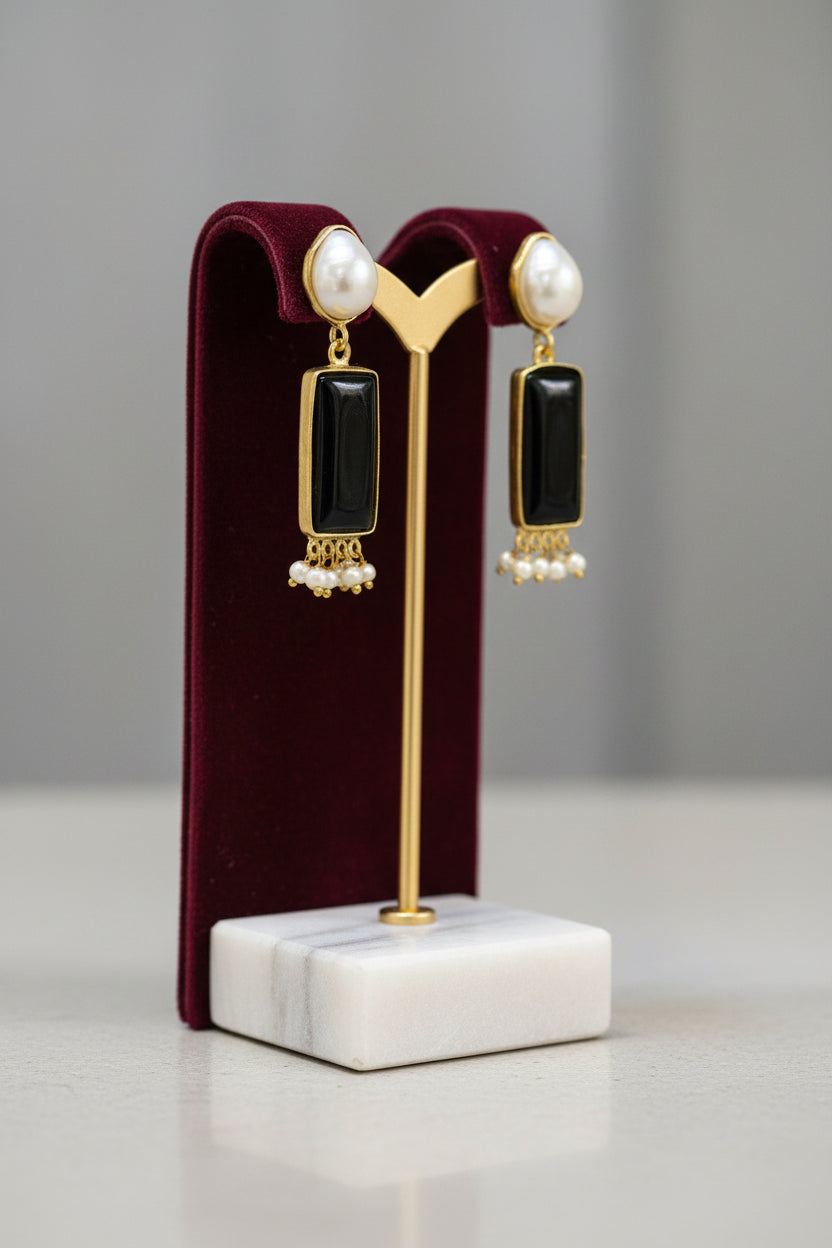 Gold polished earrings with vibrant Black stone and white baroque pearl in the top stud.