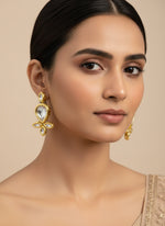 Gold tone kundan pear drop earrings by famaza couture