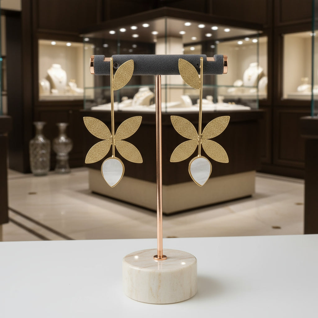 Golden textured leaf with mother of pearl leaf earrings by famaza couture