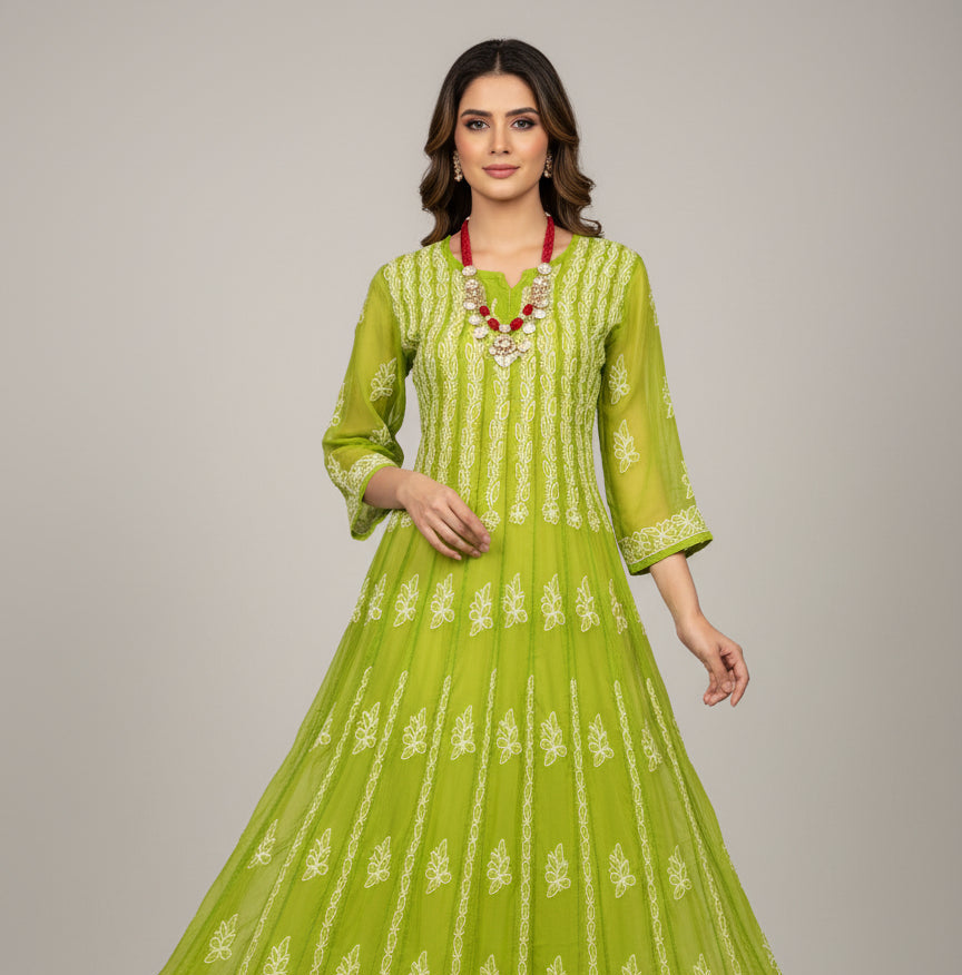 Green embroidered garment on a mannequin with a blurred background