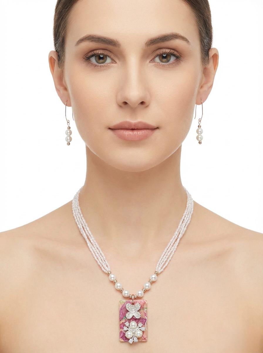 Handmade glass beaded pendant mala set with matching earrings on model in London UK