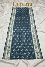 A long rectangular state blue shawl is displayed to show the full print design on it. it's 2.5 yard long and 1 yard wide